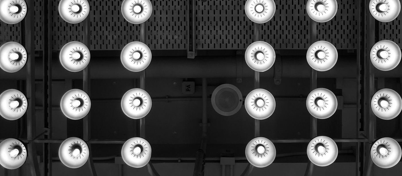 Grid of reflector lamps switched on, seen from below